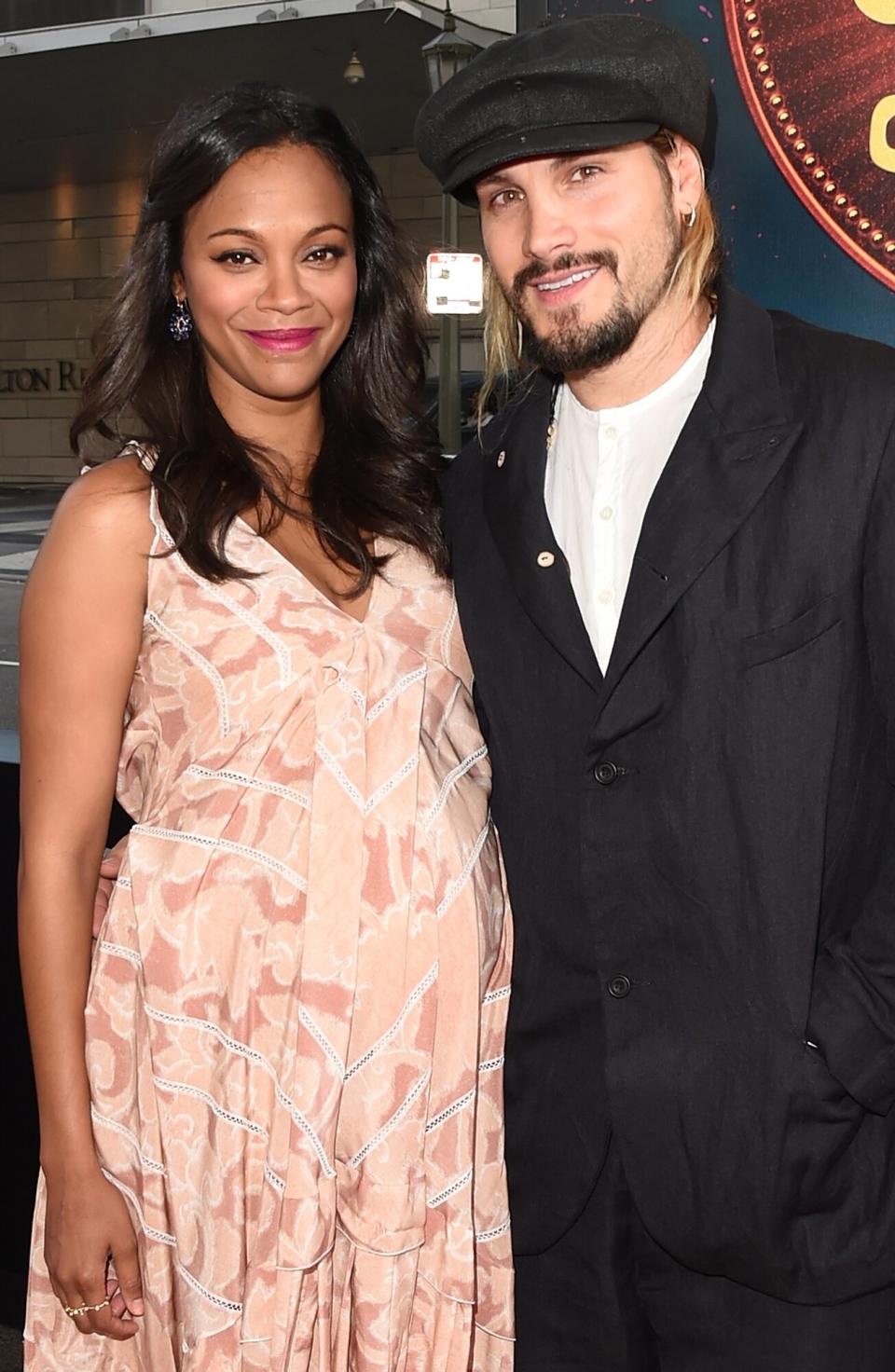 Zoe Saldana and artist Marco Perego attend the Twentieth Century Fox and Reel FX Animation Studios premiere of "The Book of Life" on Sun, Oct 12, 2014, in Los Angeles