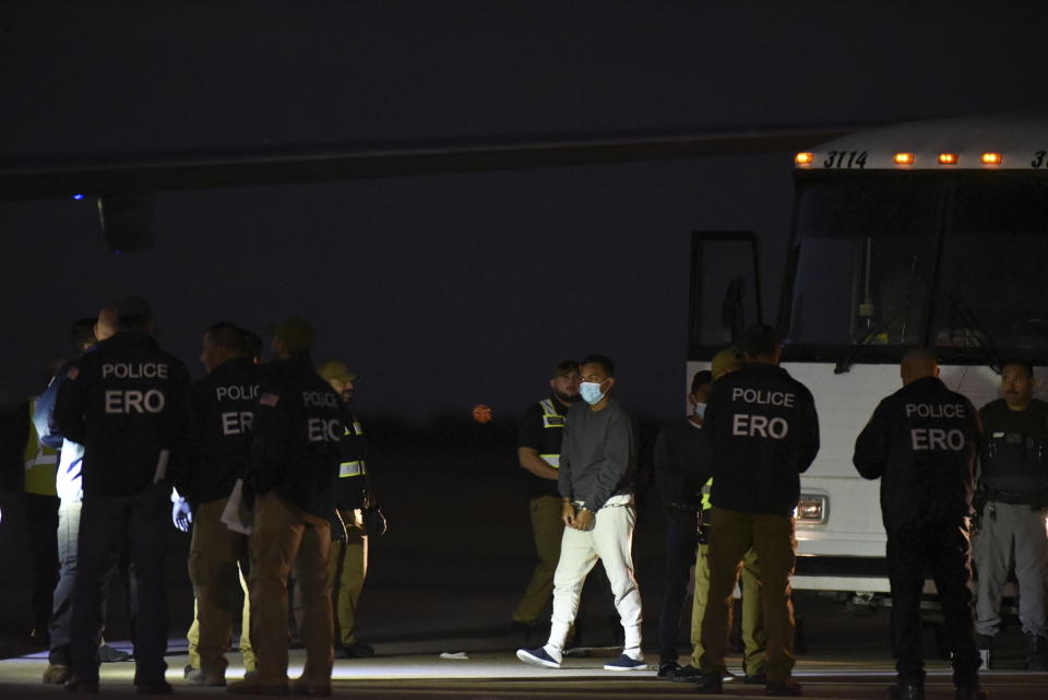 Venezuelan migrants board a plane heading back to their home country from Harlingen, Texas, on Wednesday, Oct. 18, 2023. U.S. immigration officials say passengers chosen for the deportation flight included recent arrivals as well as migrants who have committed crimes in the U.S. (AP Photo/Valerie Gonzalez)