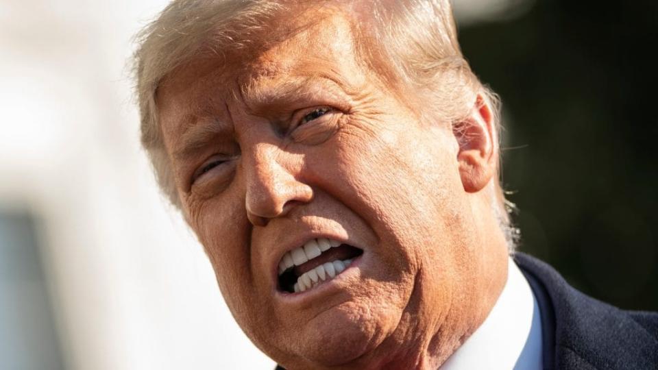 President Donald Trump speaks to reporters on the South Lawn of the White House before boarding Marine One in Washington, D.C. (Photo by Drew Angerer/Getty Images)