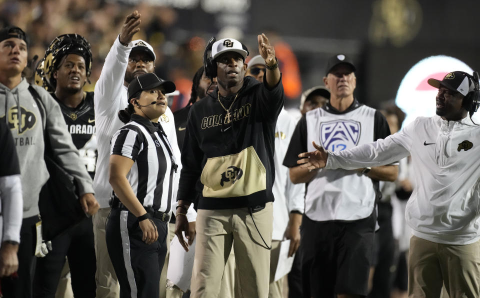 Colorado head coach Deion Sanders, center, complains about a call in the second half of an NCAA college football game against Colorado State Saturday, Sept. 16, 2023, in Boulder, Colo. (AP Photo/David Zalubowski)