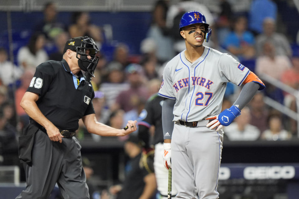 New York Mets' Mark Vientos (27) reacts after striking out looking during the fourth inning of a baseball game against the Miami Marlins, Friday, May 17, 2024, in Miami. (AP Photo/Wilfredo Lee)