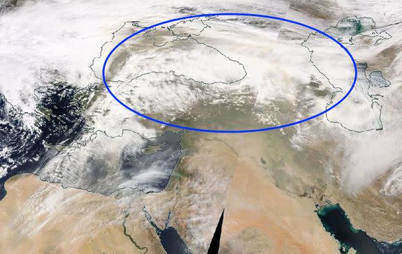 Dust plume seen within storm systems in far eastern Europe and western Eurasia.