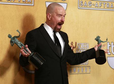 Actor Bryan Cranston poses backstage with his awards for outstanding male actor in a drama series for "Breaking Bad" and for outstanding cast in a motion picture for "Argo" at the 19th annual Screen Actors Guild Awards in Los Angeles, California January 27, 2013. REUTERS/Adrees Latif