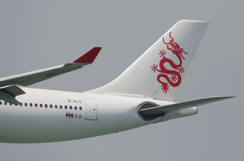 FILE PHOTO: A Cathay Dragon Airbus A330 descends before landing at Hong Kong Airport in Hong Kong