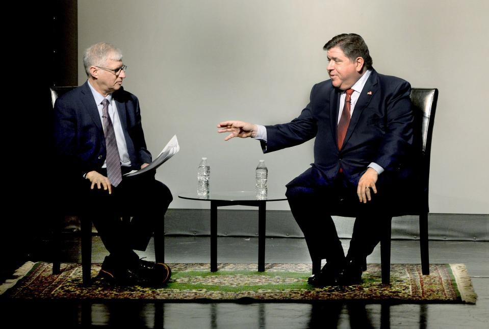 Gov. JB Pritzker, right, answers questions from retired State Journal-Register political writer and columnist Bernie Schoenburg at the Hoogland Center for the Arts Thursday, May 2, 2024.
