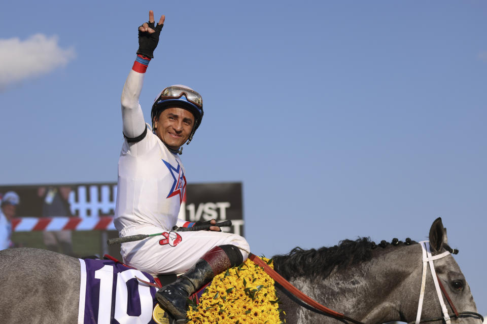 Rafael Bejarano, atop Taxed, reacts after winning the 98th running of the Black-Eyed Susan horse race at Pimlico Race Course, Friday, May 19, 2023, in Baltimore. (AP Photo/Julia Nikhinson)