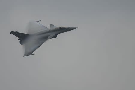 A Rafale fighter jet, built by French aircraft manufacturer Dassault Aviation, flies over Halim Air Base during a display for Indonesian defence and military officials in Jakarta March 25, 2015 in this photo taken by Antara Foto. REUTERS/Antara Foto/Widodo S. Jusuf