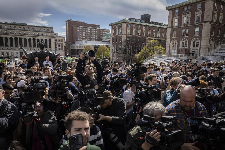 Students and press look on as Speaker of the House Mike Johnson, R-La., speaks to the media on the Lower Library steps on Columbia University's campus in New York, on Wednesday, April 24, 2024. (AP Photo/Stefan Jeremiah)