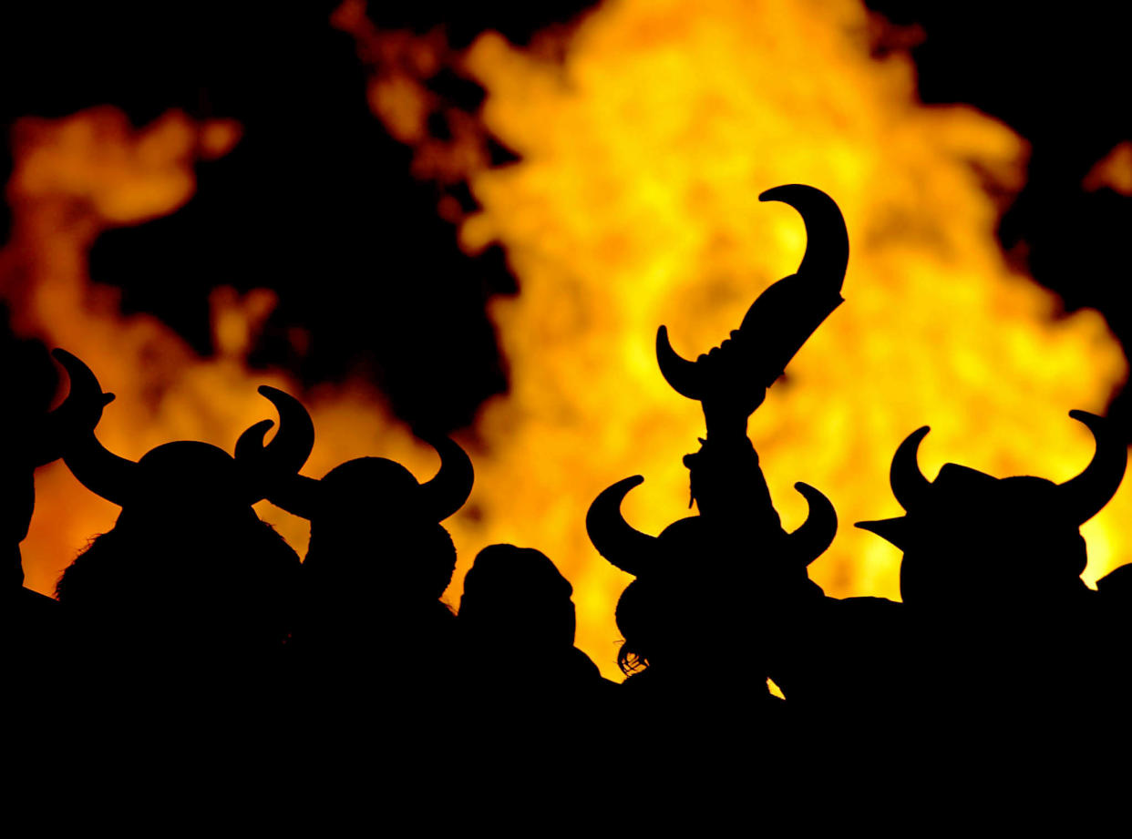 UP HELLY AA FESTIVAL PARTICIPANTS DRESSED IN COSTUME ARE SILHOUETTED AGAINST  BURNING VIKING GALLEY IN SCOTLAND.    Locals dressed in costume are silhouetted against a burning replica Viking  galley in Lerwick during the Up Helly Aa Festival on the Island of Shetland  in Scotland January 28, 2003. The Up Helly Aa Festival, introduced by men  returning from the Napoleonic Wars of the early 19th century, takes place  annually on the last Tuesday of January. Participants drag the replica  Viking galley through the streets of Lerwick to a designated point where it  is ceremonially burnt. NO RIGHTS CLEARANCES OR PERMISSIONS ARE REQUIRED FOR THIS IMAGE Pictures of the Year 2003 REUTERS/Jeff J  Mitchell