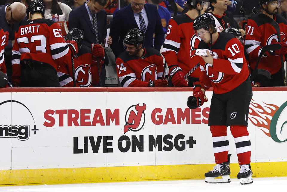 New Jersey Devils right wing Alexander Holtz (10) goes to the bench after an during the second period of the team's NHL hockey game against the New York Rangers on Saturday, Nov. 18, 2023, in Newark, N.J. (AP Photo/Noah K. Murray)