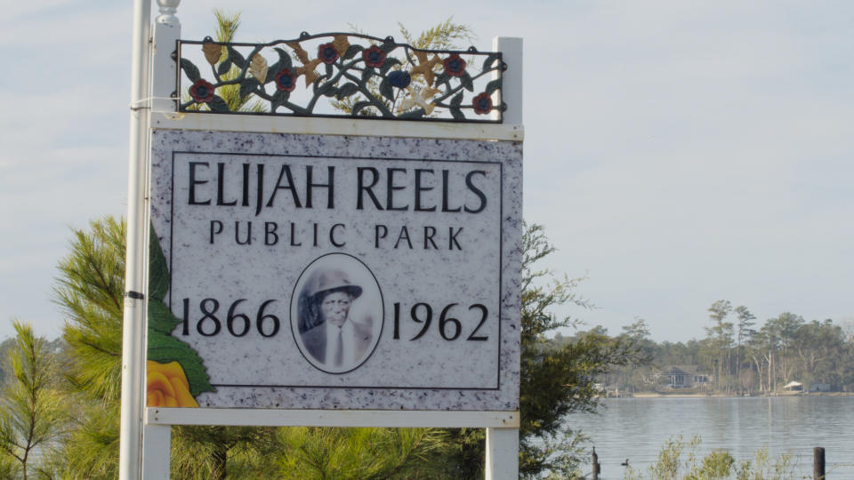 A sign for Elijah Reels Public Park