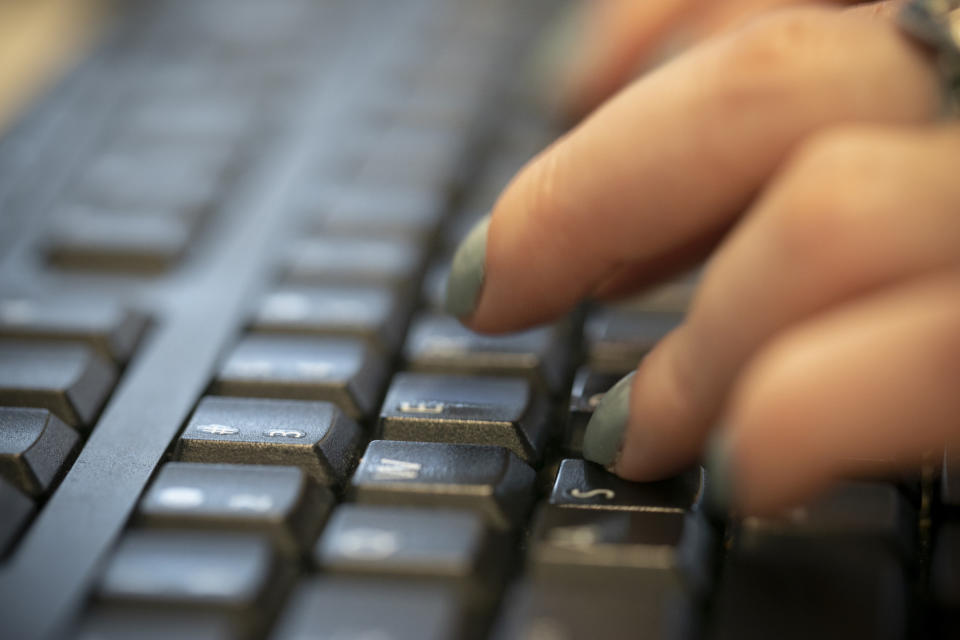 FILE - In this Oct. 8, 2019, file photo a woman types on a keyboard in New York. Forty million Californians will shortly obtain sweeping digital privacy rights stronger than any seen before in the U.S., posing a significant challenge to Big Tech and the data economy it helped create. (AP Photo/Jenny Kane, File)