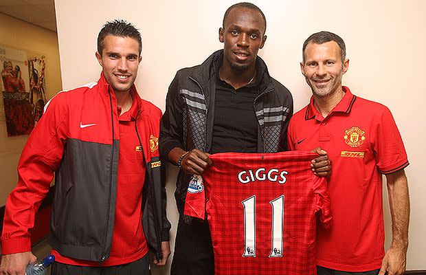 Bolt meets his Manchester United heroes, Robin van Persie and Ryan Giggs. Source: Getty