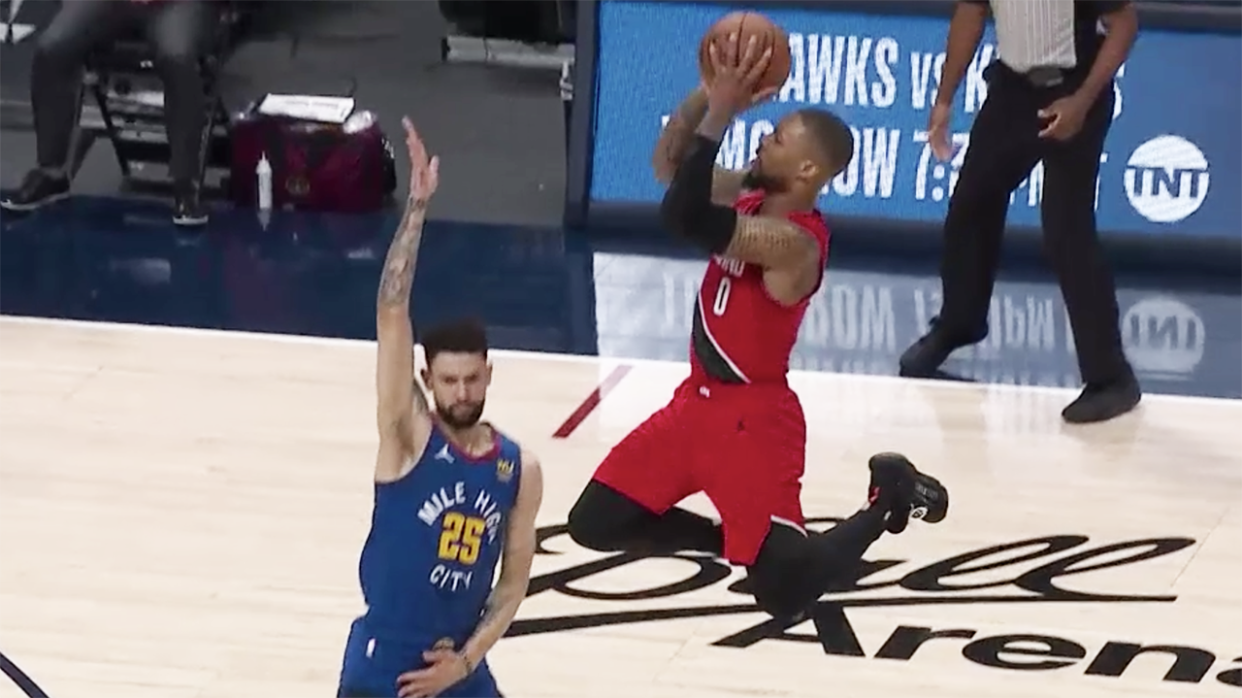 NBA fans erupted after referees called a foul on Denver's Austin Rivers in this play on Portland's Damian Lillard, which led to two overtime periods. Picture: NBA TV