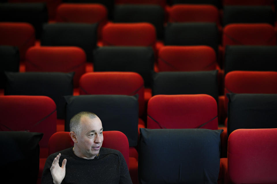 Romanian investigative journalist Catalin Tolontan speaks during an interview with the Associated Press at the Elvire Popesco cinema in Bucharest, Romania, Monday, April 12, 2021. The Oscar-nominated Romanian documentary film “Collective” follows a group of journalists delving into the state of health care in the eastern European country in the wake of a deadly 2015 nightclub fire that left dozens of burned victims in need of complex treatment. What they revealed was decades of deep-rooted corruption, a heavily politicized system scarily lacking in care. (AP Photo/Andreea Alexandru)