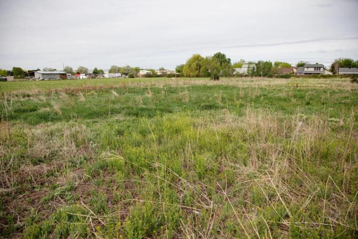 This field in Boise behind Shamrock Avenue will become Whitney Commons, an affordable housing subdivision featuring 11 newly constructed homes for sale and one remodeled home for rent.