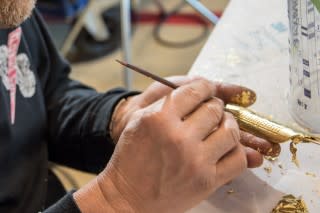 Gold leaf application process at Koenigsegg factory in Ängelholm, Sweden