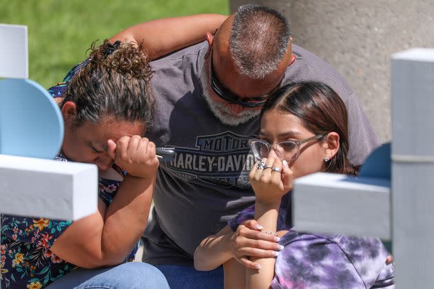 Mourners visit a memorial for victims of Tuesday's mass shooting at Robb Elementary School in Uvalde, Texas. (Photo: Anadolu Agency via Getty Images)