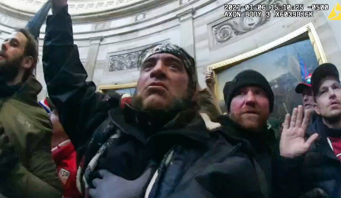 Robert Chapman, center, inside the Capitol on Jan. 6, 2021. (Dept. of Justice)