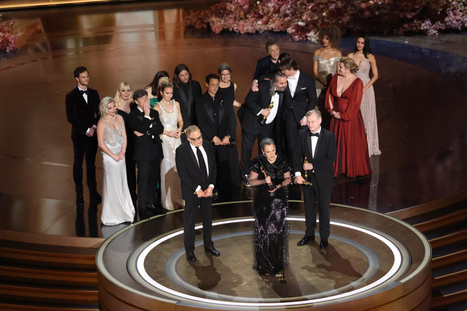 Group of celebrities on stage at an awards ceremony