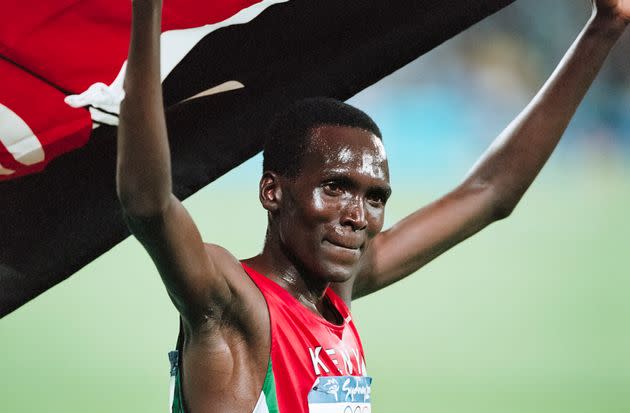 SYDNEY -  SEPTEMBER 25:  Paul Tergat of Kenya waves the Kenyan flag following his silver medal run in the Men's 10,000 meter race of the 2000 Olympics run on September 25, 2000 in the Olympic Stadium in Sydney, Australia.  (Photo by David Madison/Getty Images) (Photo: David Madison via Getty Images)