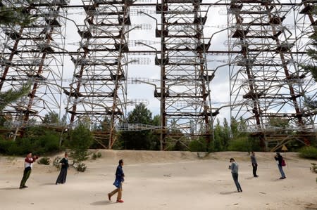 Visitors inspect constructions of a former Soviet Union over-the-horizon (OTH) radar system "Duga" near the Chernobyl Nuclear Power Plant, near Chernobyl