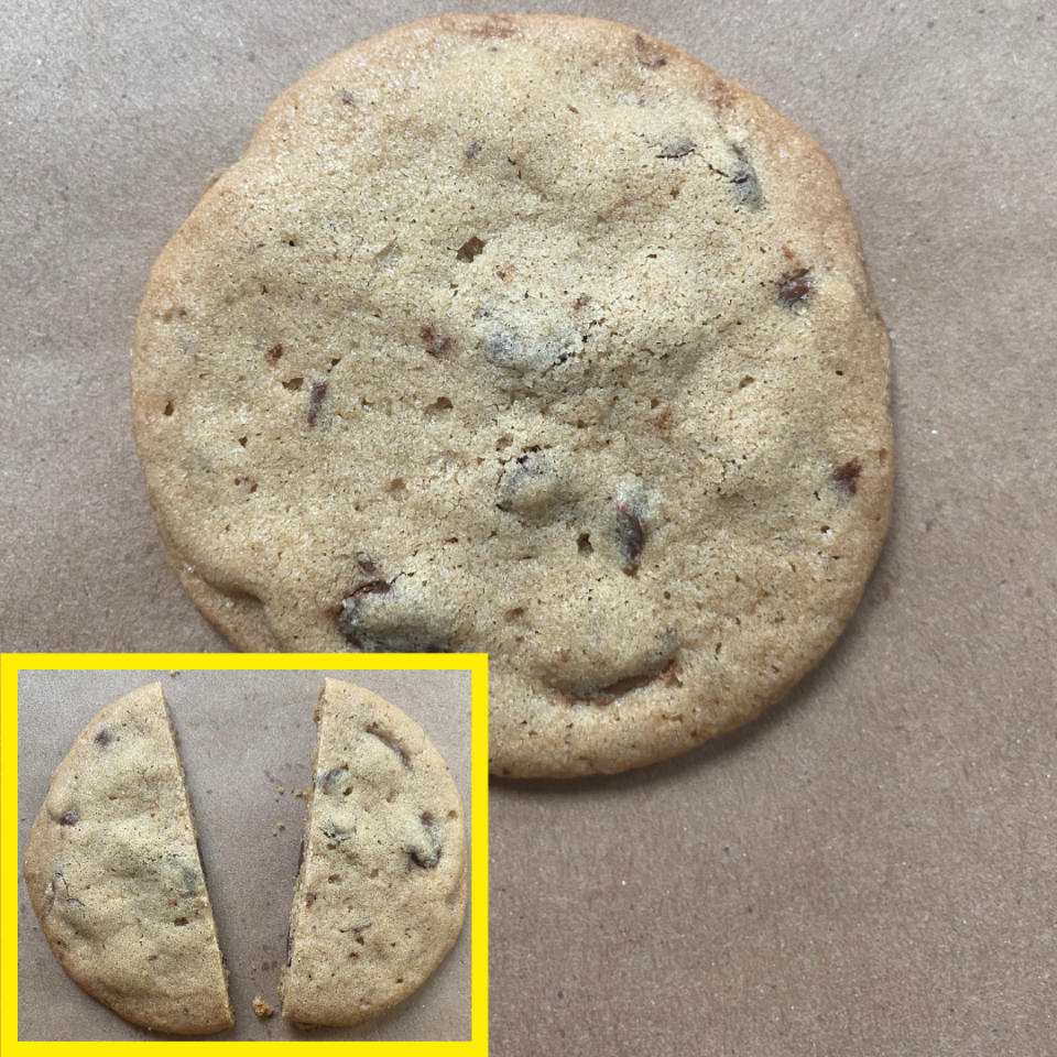 A round chocolate chip cookie on a brown background. In a yellow box at the bottom left, the same cookie is shown cut in half