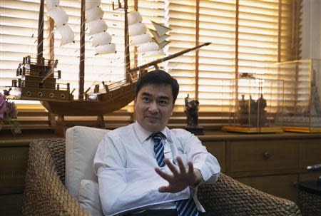 Thailand's opposition leader and former Prime Minister Abhisit Vejjajiva gestures during an interview with foreign media at his Democrat Party headquarters in Bangkok April 23, 2014. THAILAND-PROTEST/ REUTERS/Darren Whiteside