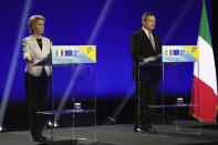 Italian Premier Mario Draghi, right, and European Commission President Ursula von der Leyen speak to the media during a news conference at the Cinecitta' studios in Rome, Tuesday, June 22, 2021. (AP Photo/Andrew Medichini)