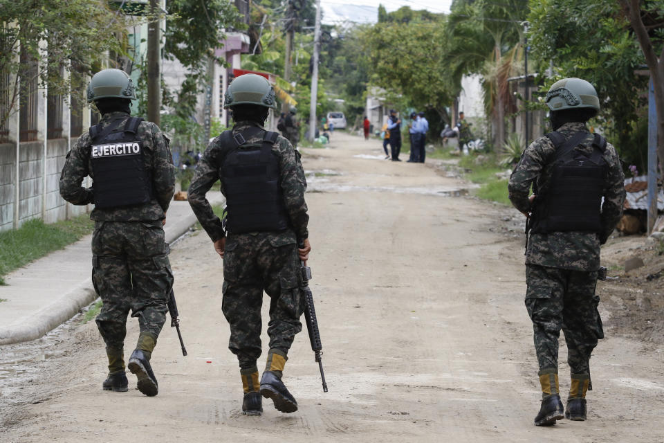 Soldiers patrol the Riviera Hernandez neighborhood in San Pedro Sula, Honduras, Tuesday, June 27, 2023. Honduran President Xiomara Castro has decreed a state of emergency in some provinces of the Central American nation, and the government distributed video Tuesday of police tearing down a cyclone fence a gang had erected in a town in northern Honduras to mark its territory. (AP Photo/Delmer Martinez)