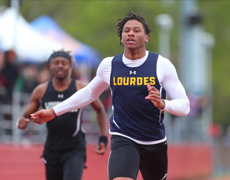 Lourdes' Chris Boston wins the 100-meter dash during day 2 of the Somers Lions Club Joe Wynne Track and Field Invitational at Somers High School in Lincolndale on Saturday, May 7, 2022.