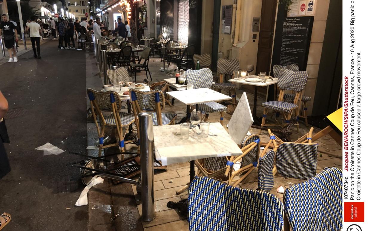 Tables and chair are upturned on Canne's Coup de Feu after crowds raced for safety  - Shutterstock