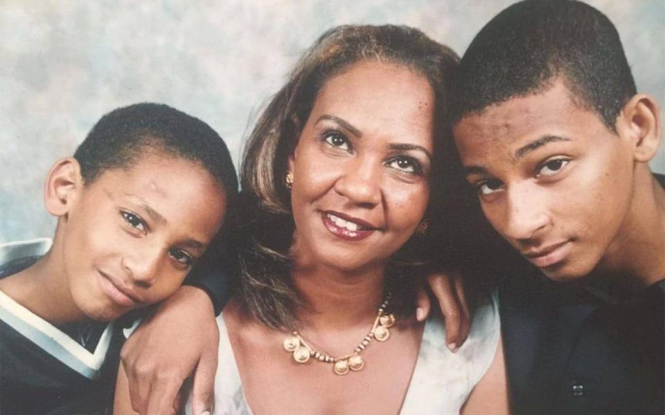 El Shafee Elsheikh, right, pictured as a 15-year-old with his mother Maha Elgizouli and younger brother Mahmoud - Washington Post