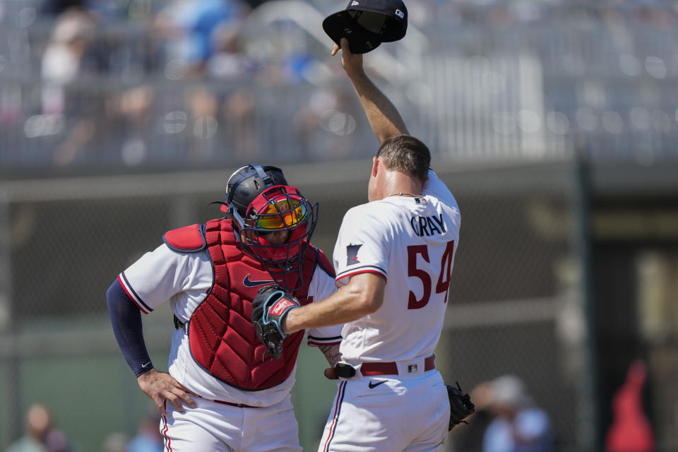 Minnesota Twins starting pitcher Sonny Gray (54) talks with catcher Christian Vazquez in the first inning of a spring training baseball game against the Boston Red Sox in Fort Myers, Fla., Friday, March 3, 2023. (AP Photo/Gerald Herbert)