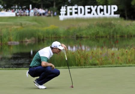 Sep 1, 2018; Norton, MA, USA; Justin Rose lines up his putt on the 16th hole during the second round of the Dell Technologies Championship golf tournament at TPC of Boston. Mandatory Credit: Mark Konezny-USA TODAY Sports