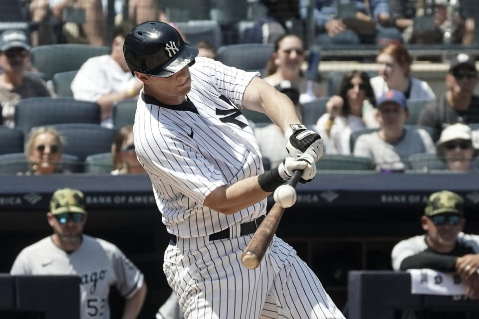 New York Yankees' DJ LeMahieu (26) hits a grand slam during the second inning of a baseball game against Chicago White Sox, Saturday, May 21, 2022, in New York. (AP Photo/Bebeto Matthews)