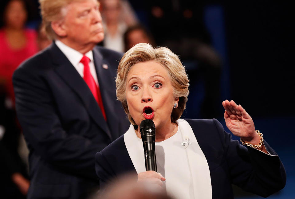 <p>Hillary Clinton (R) speaks as Republican presidential nominee Donald Trump looks on during the town hall debate at Washington University on Oct. 9, 2016 in St Louis, Mo. (Photo: Rick Wilking-Pool/Getty Images) </p>