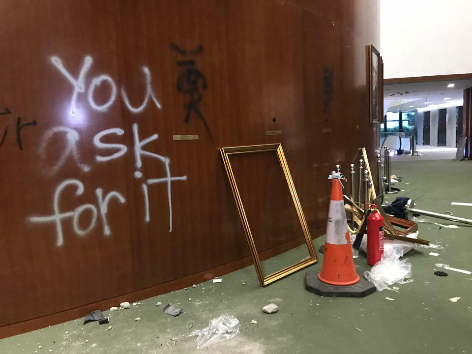 In this July 3, 2019, file photo, amage to the lobby of the Legislative Council following a break-in by protesters is seen during a media tour in Hong Kong. (AP Photo/Johnson Lai, File)