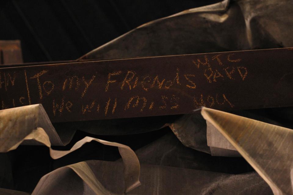 A message is seen on the bottom of the "Cross", intersecting steel beams found in the rubble of 6 World Trade Center that was destroyed on September 11, 2001, displayed in The National September 11 Memorial and Museum, under construction, at the World Trade Center site in New York, September 6, 2013. The Memorial and Museum is scheduled to be opened to the public in the spring of 2014. (REUTERS/Brendan McDermid)