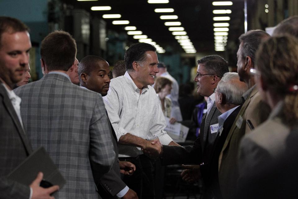 Republican presidential candidate, former Massachusetts Gov. Mitt Romney shakes hands with supporters at a town hall-style meeting in Euclid, Ohio, Monday, May 7, 2012. (AP Photo/Jae C. Hong)
