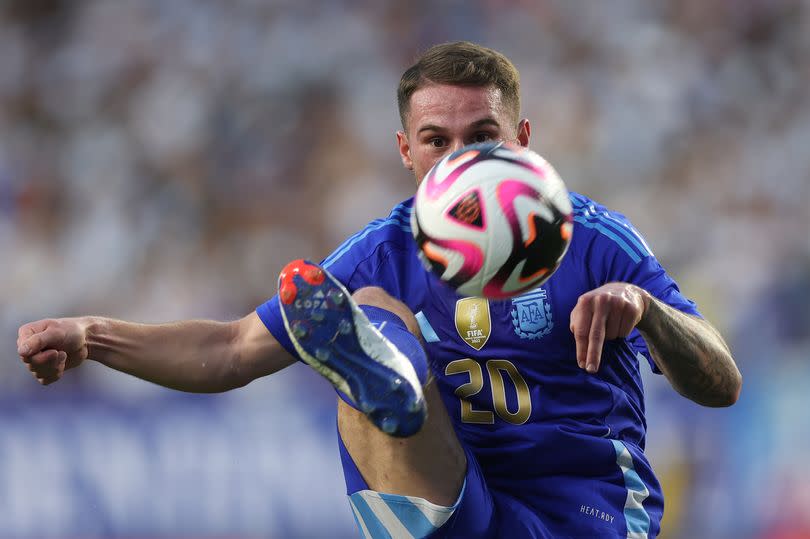 Alexis Mac Allister #20 of Argentina passes the ball in the first half during an International Friendly between Guatemala and Argentina at Commanders Field on June 14, 2024 in Landover, Maryland.