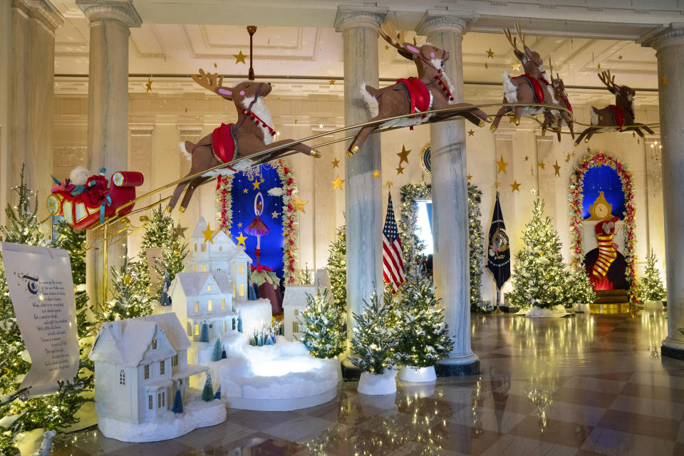 Holiday decorations adorn the Grand Foyer of the White House for the 2023 theme "Magic, Wonder, and Joy," Monday, Nov. 27, 2023, in Washington. (AP Photo/Evan Vucci)