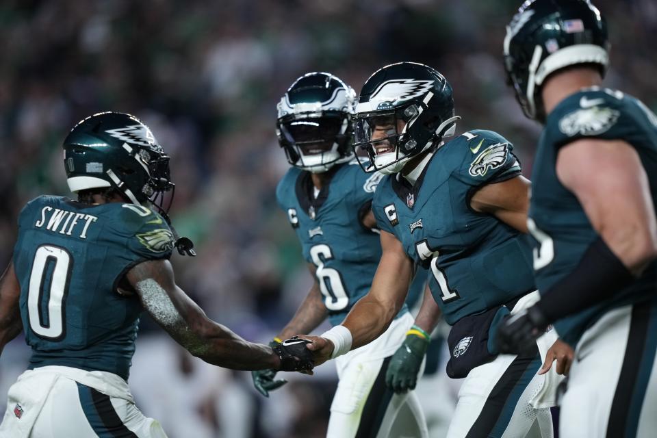 Philadelphia Eagles quarterback Jalen Hurts (1) celebrates his touchdown with Philadelphia Eagles running back D'Andre Swift (0) during the second half of an NFL football game against the Minnesota Vikings on Thursday, Sept. 14, 2023, in Philadelphia. (AP Photo/Matt Slocum)