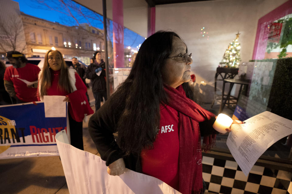 Community organizer Francisca Gomez sings carols outside of a storefront base for an immigration non-profit during a Posada celebration, Sunday, Dec. 17, 2023, in Fort Morgan, Colo. Organizers put on the Posada, a Latin-American tradition based on the religious events of Joseph and Mary searching for shelter before the birth of Jesus, as a way for migrants in Colorado to feel a sense of unity during the holiday season. (AP Photo/Julio Cortez)