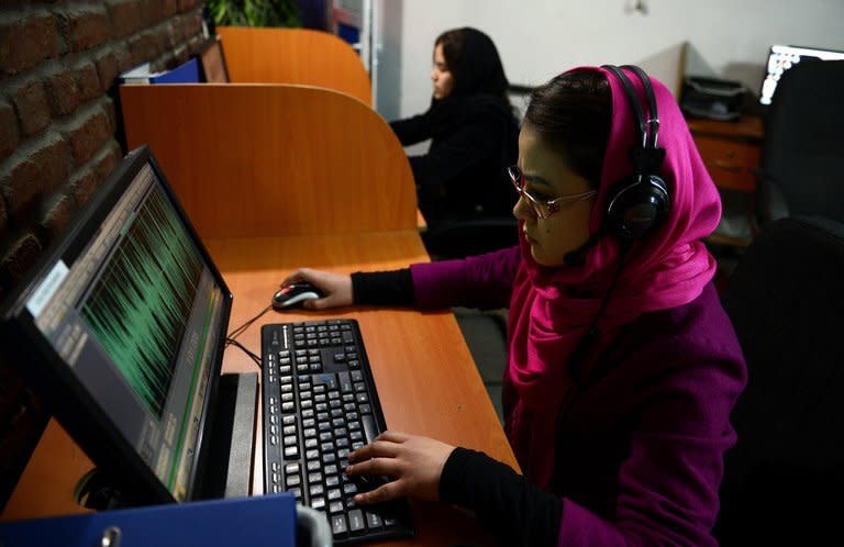 Employees are pictured working at Awaz, the private company that owns Globox.tv, in Kabul on January 30, 2013. Globox.tv is the latest product of a media revolution in Afghanistan since the fall of the Taliban regime and the station's bosses hope its bold programmes will attract younger viewers