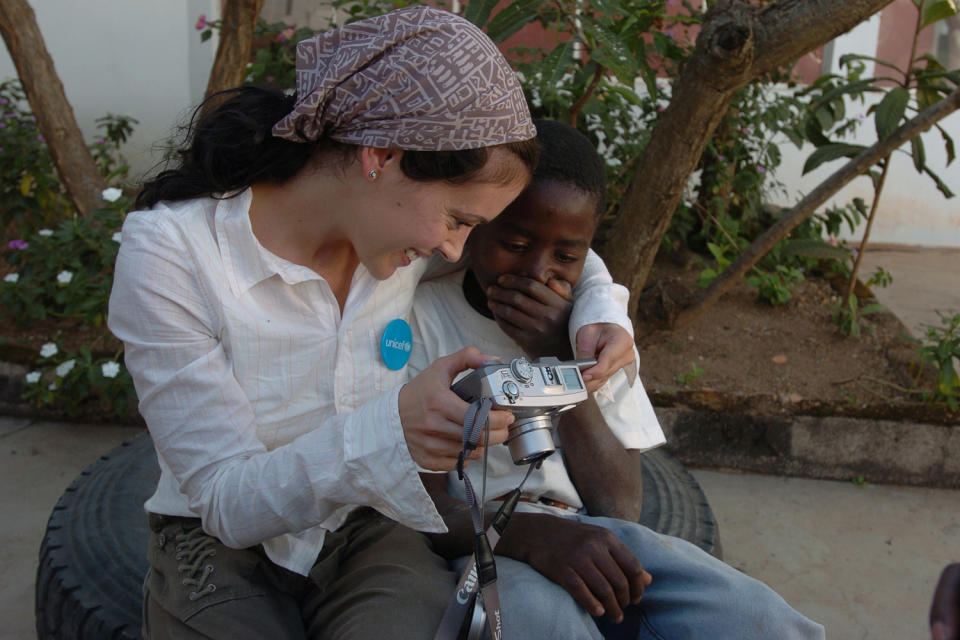 <p>Her first trip with UNICEF, Milano says, "was only two years after the peace treaty was signed [after] the civil war. There was no infrastructure. These children were going to school and living next to active minefield. Kids would have to walk through active minefields with stakes that were in the ground, that enabled them to know what path was safe." </p>