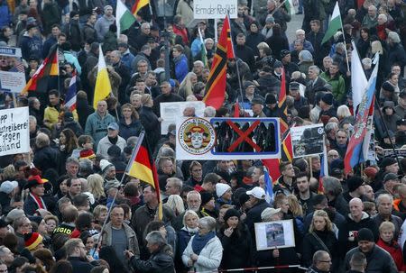 People gather for an anti-immigration demonstration organised by rightwing movement Patriotic Europeans Against the Islamisation of the West (PEGIDA) in Dresden, Germany October 19, 2015. REUTERS/Fabrizio Bensch