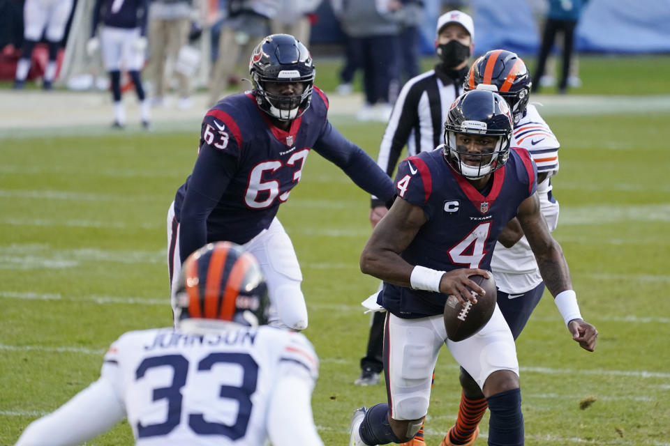 Houston Texans quarterback Deshaun Watson (4) runs during the second half of an NFL football game against the Chicago Bears, Sunday, Dec. 13, 2020, in Chicago. (AP Photo/Nam Y. Huh)