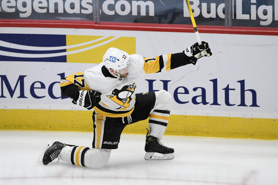 Pittsburgh Penguins right wing Bryan Rust celebrates his goal during the second period of the team's NHL hockey game against the Washington Capitals, Saturday, May 1, 2021, in Washington. (AP Photo/Nick Wass)