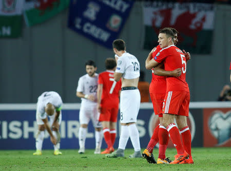 Soccer Football - 2018 World Cup Qualifications - Europe - Georgia vs Wales - Boris Paichadze Dinamo Arena, Tbilisi, Georgia - October 6, 2017 Wales' Ashley Williams and James Chester celebrate after the game REUTERS/David Mdzinarishvili